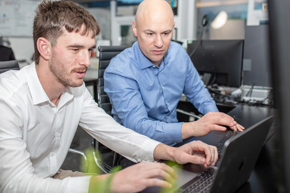 David and Luke from Halizona working on a client website at their desk